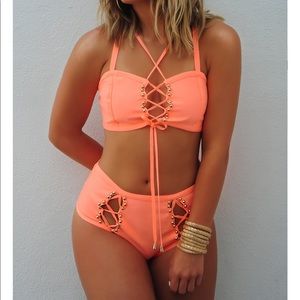 Neon peach colored swimsuit